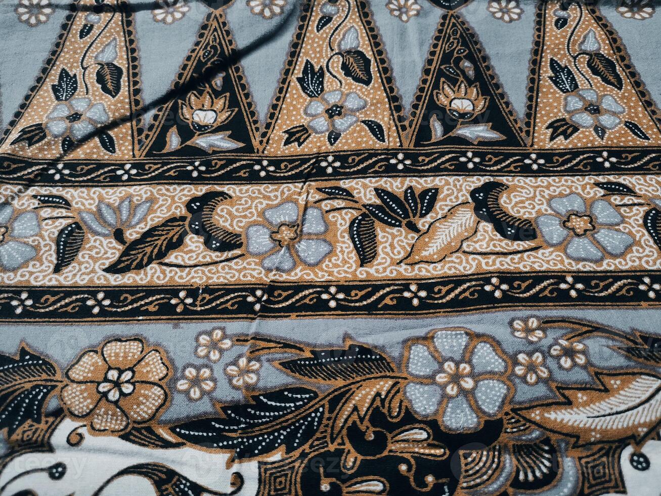 close up of a black and gold patterned fabric photo