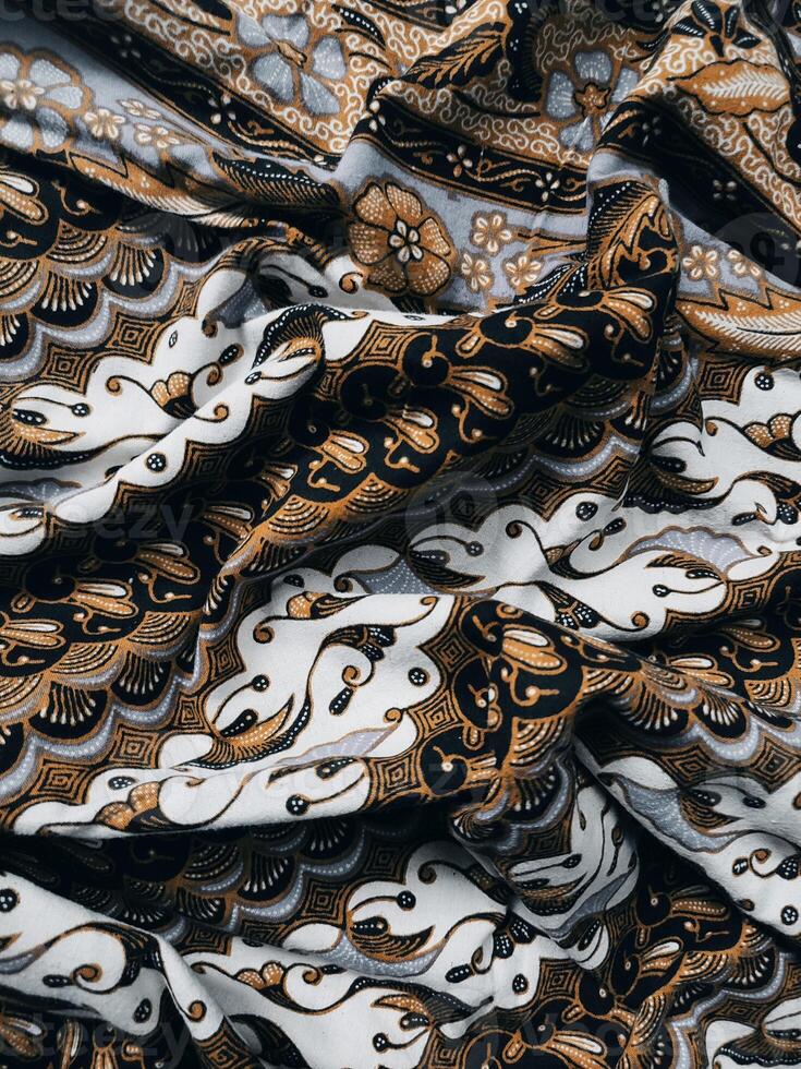 background pattern featuring motifs commonly found in Javanese batik. The pattern is symmetrical and abstract, and can be used on fabric, clothing, artwork, or wrapping paper designs photo