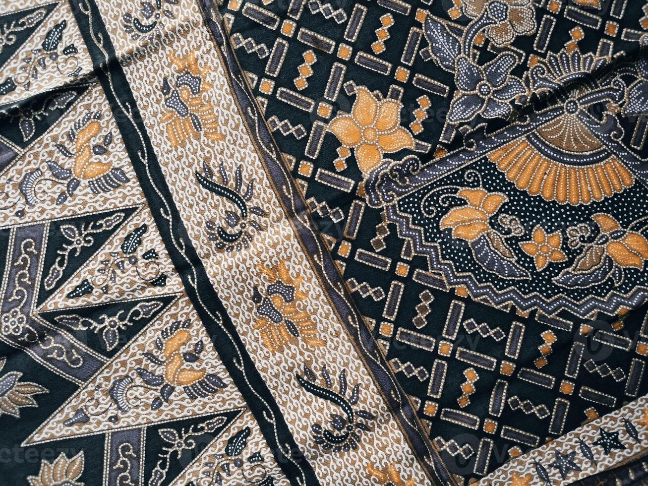 A black and gold patterned fabric with pattern photo