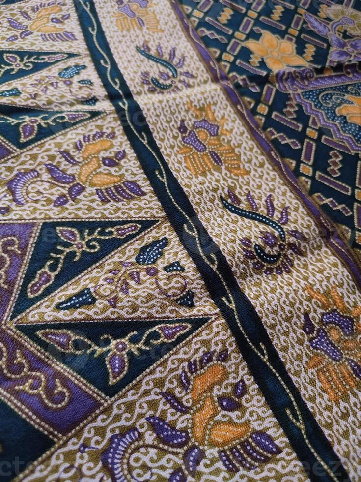 a close up of a colorful and intricate pattern on a bedspread photo