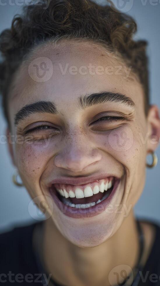 Portrait of a young man laughing photo