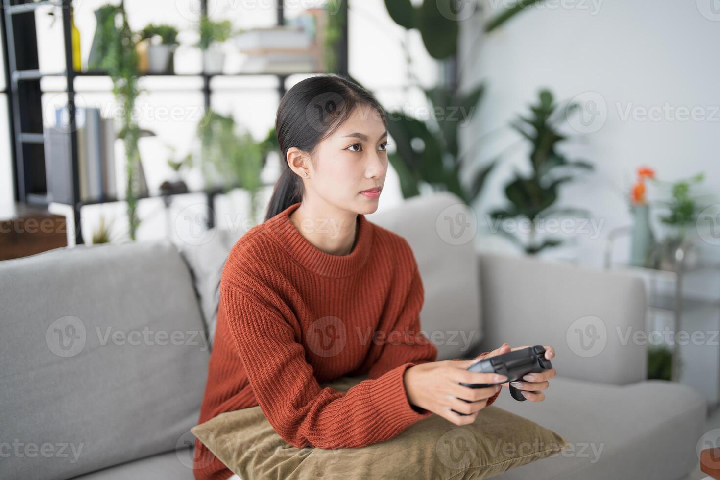 Young Asian woman gamer controller vdo console playing holding hobby playful Online Vdo Game enjoyment eSport Game Internet. photo