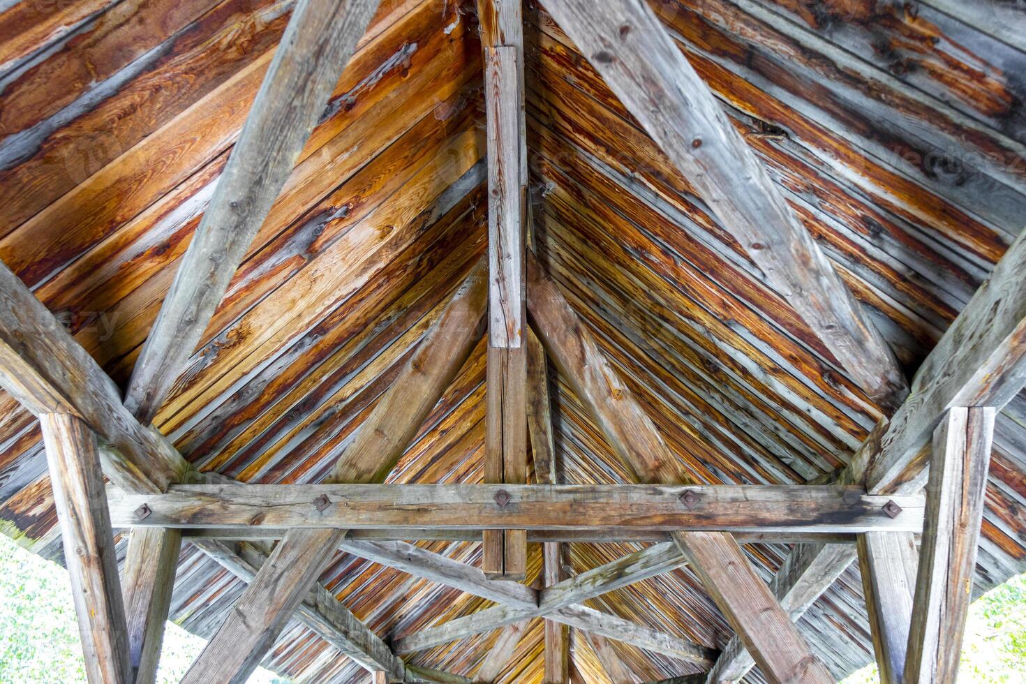 Wooden bridge above river steam waterfall Inn in Tyrol. photo