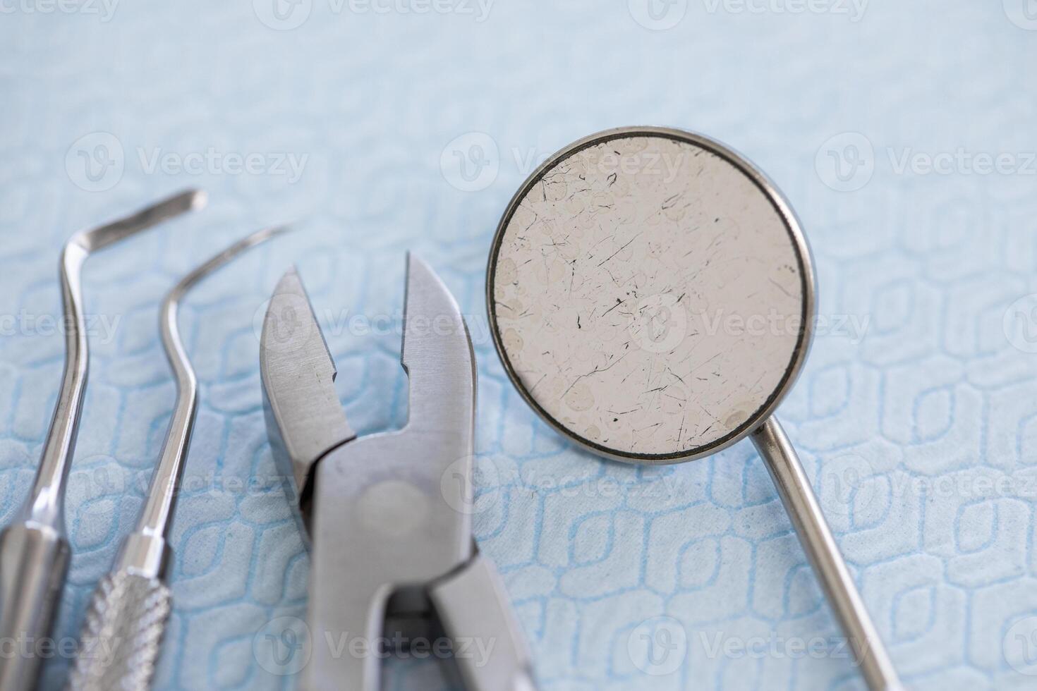Dental tools and instruments on a blue surface photo