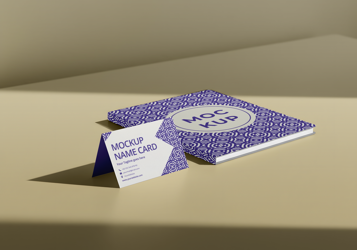 A mockup of a name card and a patterned notebook psd