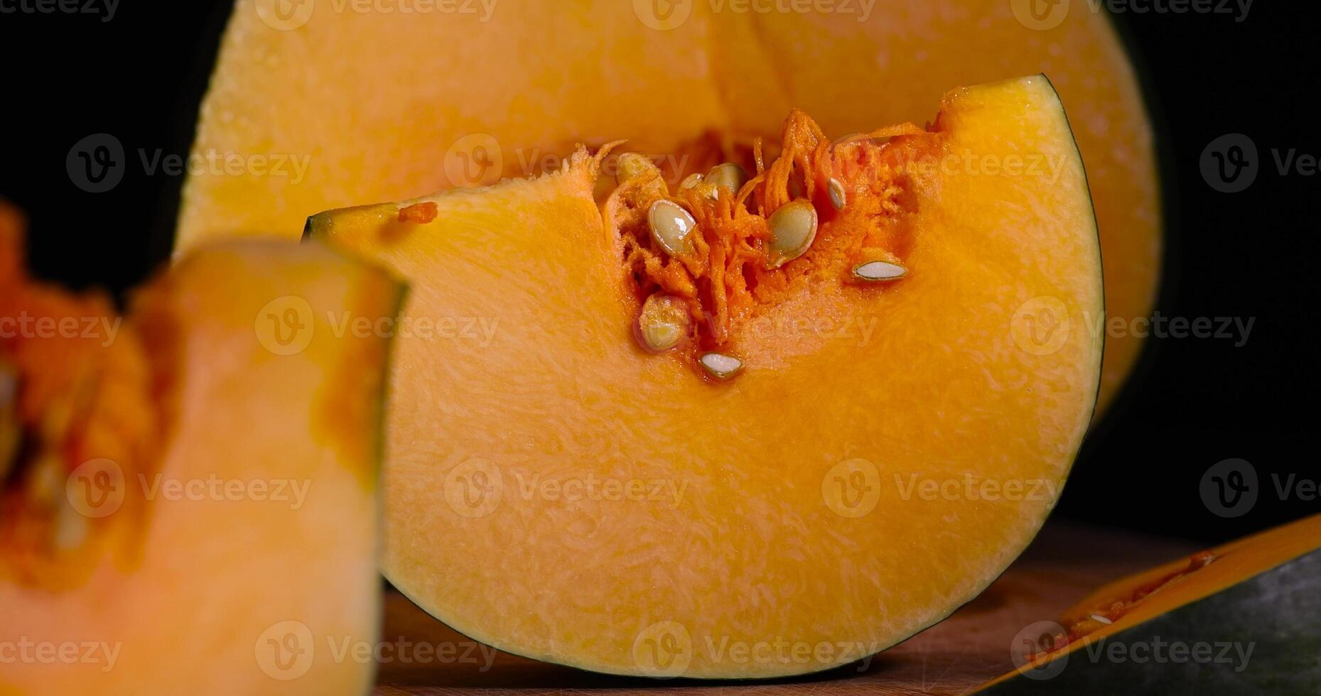 a piece of bright orange ripe pumpkin for cooking photo