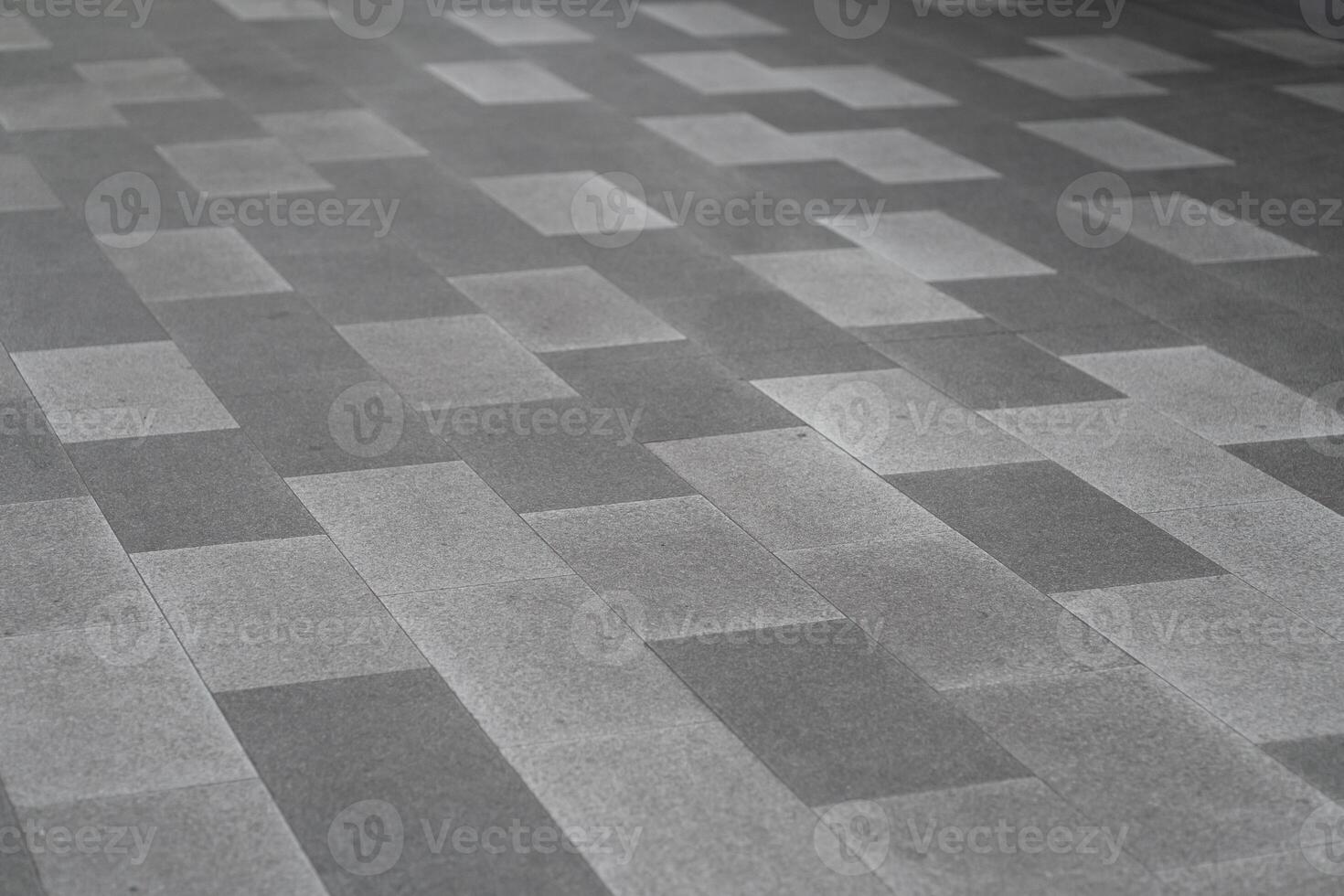 Gray Stone Tile Floor Pattern Background. a modern gray stone tile floor with a geometric rectangular pattern. photo