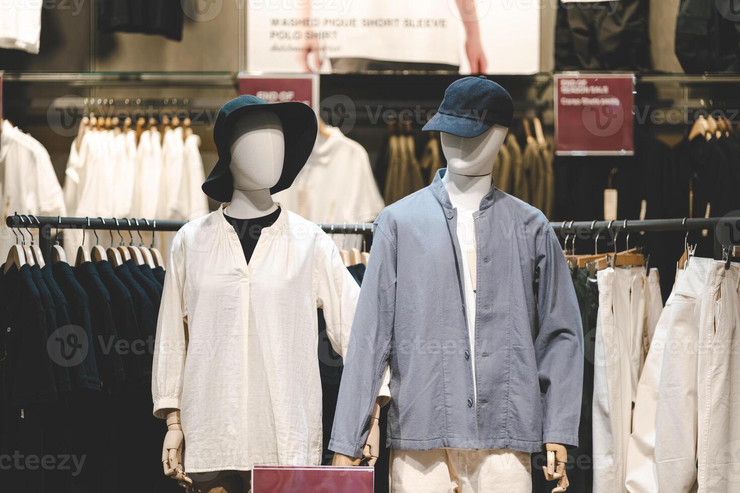 Casual Clothing Display on Mannequins in Fashion Retail Store. Mannequins dressed in casual, minimalist outfits displayed in a modern fashion retail store. photo