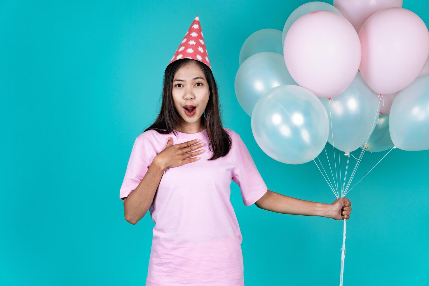 Portrait of Cheerful Young Asian Woman Celebrating Birthday And Surprise photo