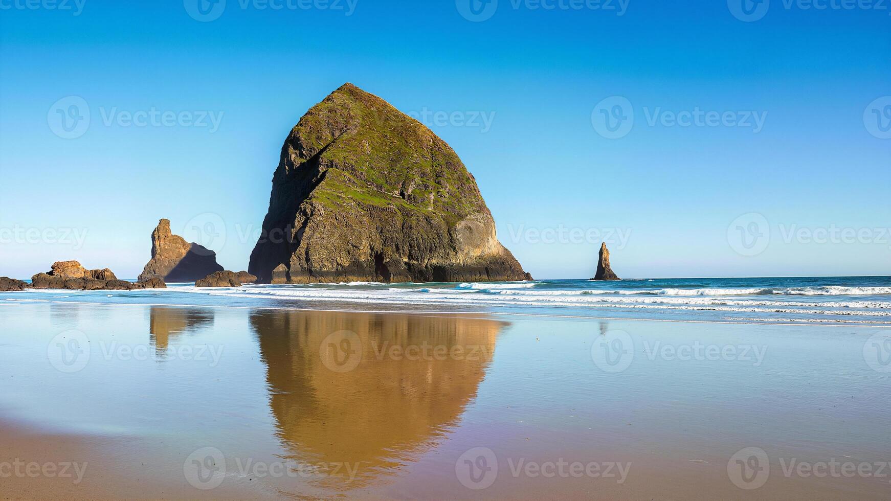 A large rock formation on the beach photo