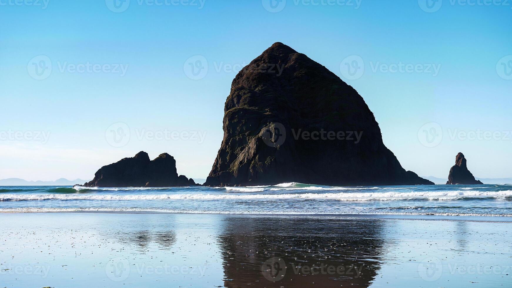 A large rock on the beach photo