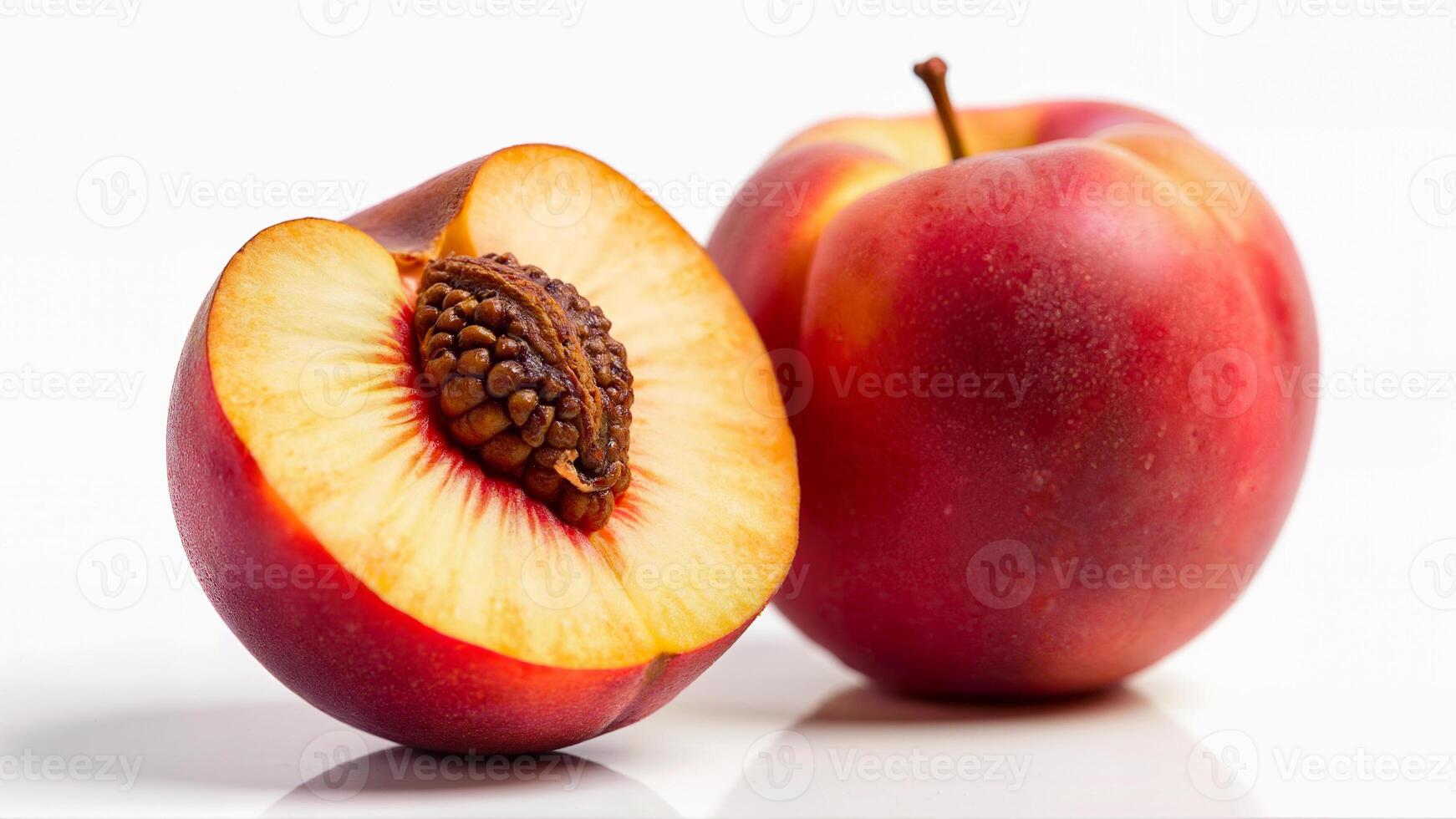 Isolated red peach, one half showing the pit and tender flesh, on a white background. Useful for food, nutrition, and healthy eating concepts. photo