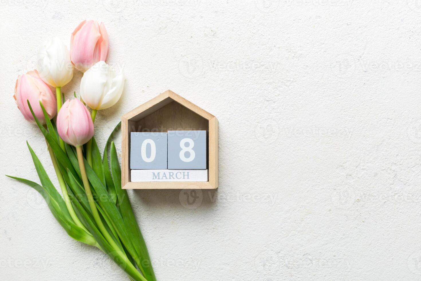 8 March, International Women's Day. greeting card design with tulips and calendar photo