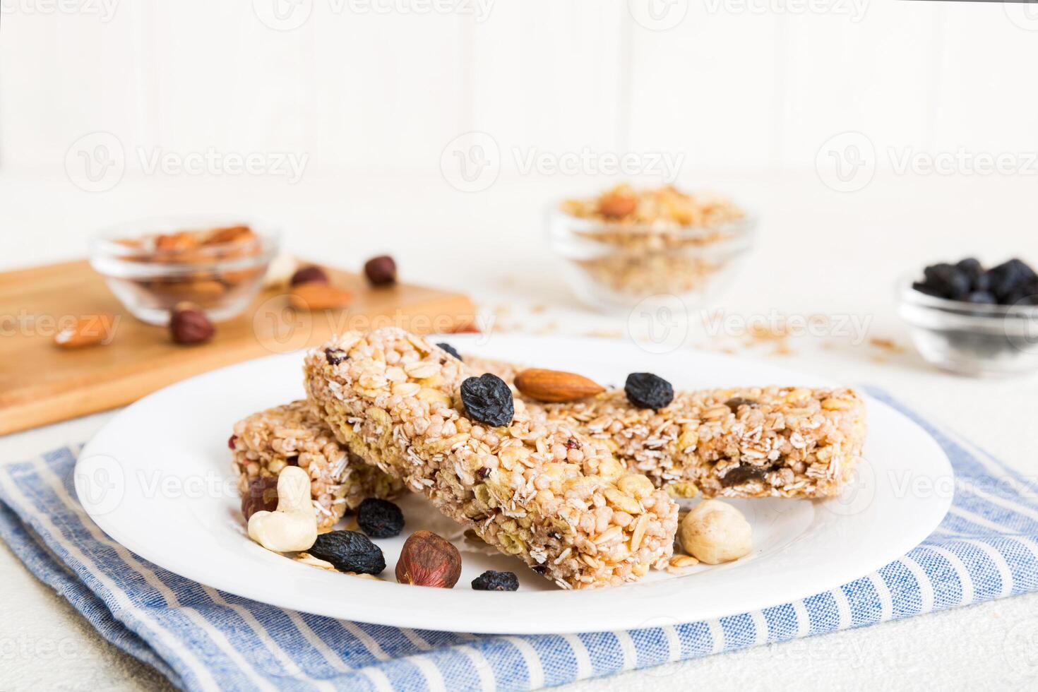Various granola bars on table. Cereal granola bars. Superfood breakfast bars with oats, nuts and berries, close up. Superfood concept photo