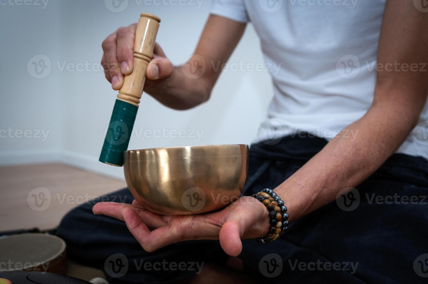 Tibetan Chanting Bow with man's hand photo