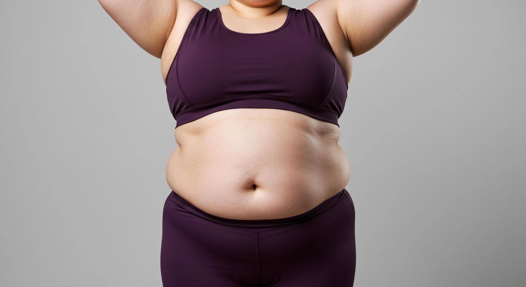 A woman in a purple sports bra top and pants photo