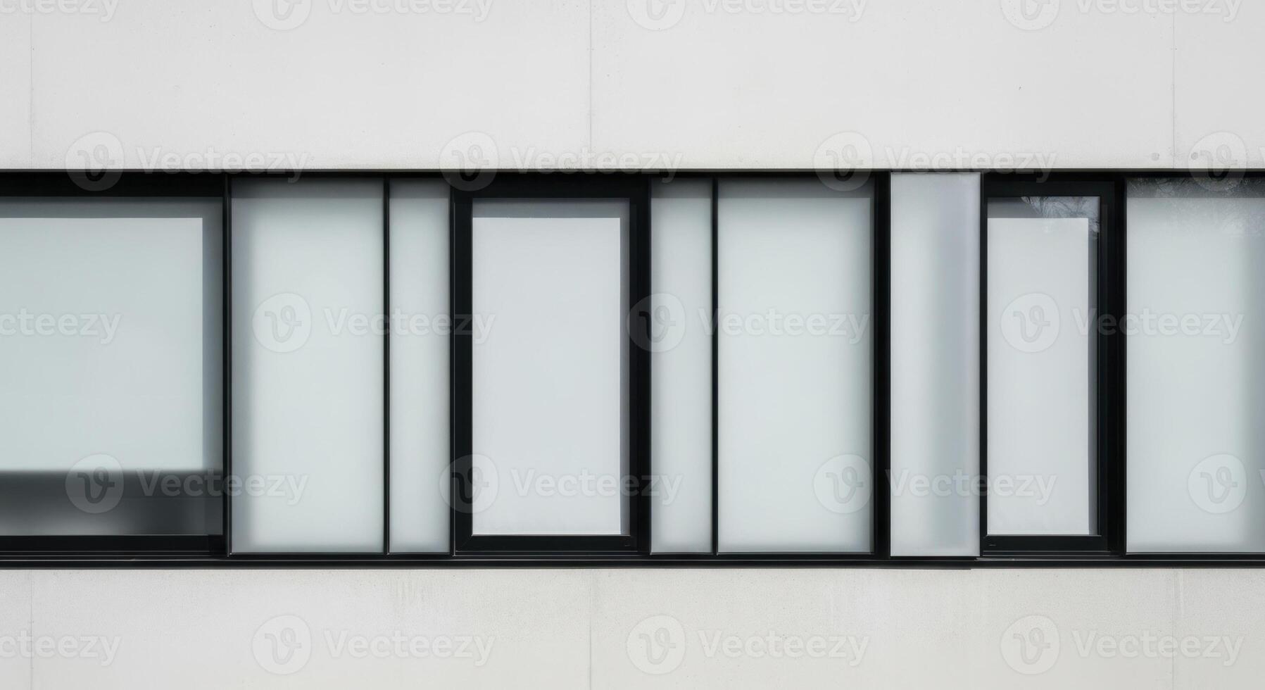Sleek modern building exterior with black framed frosted glass window design. photo