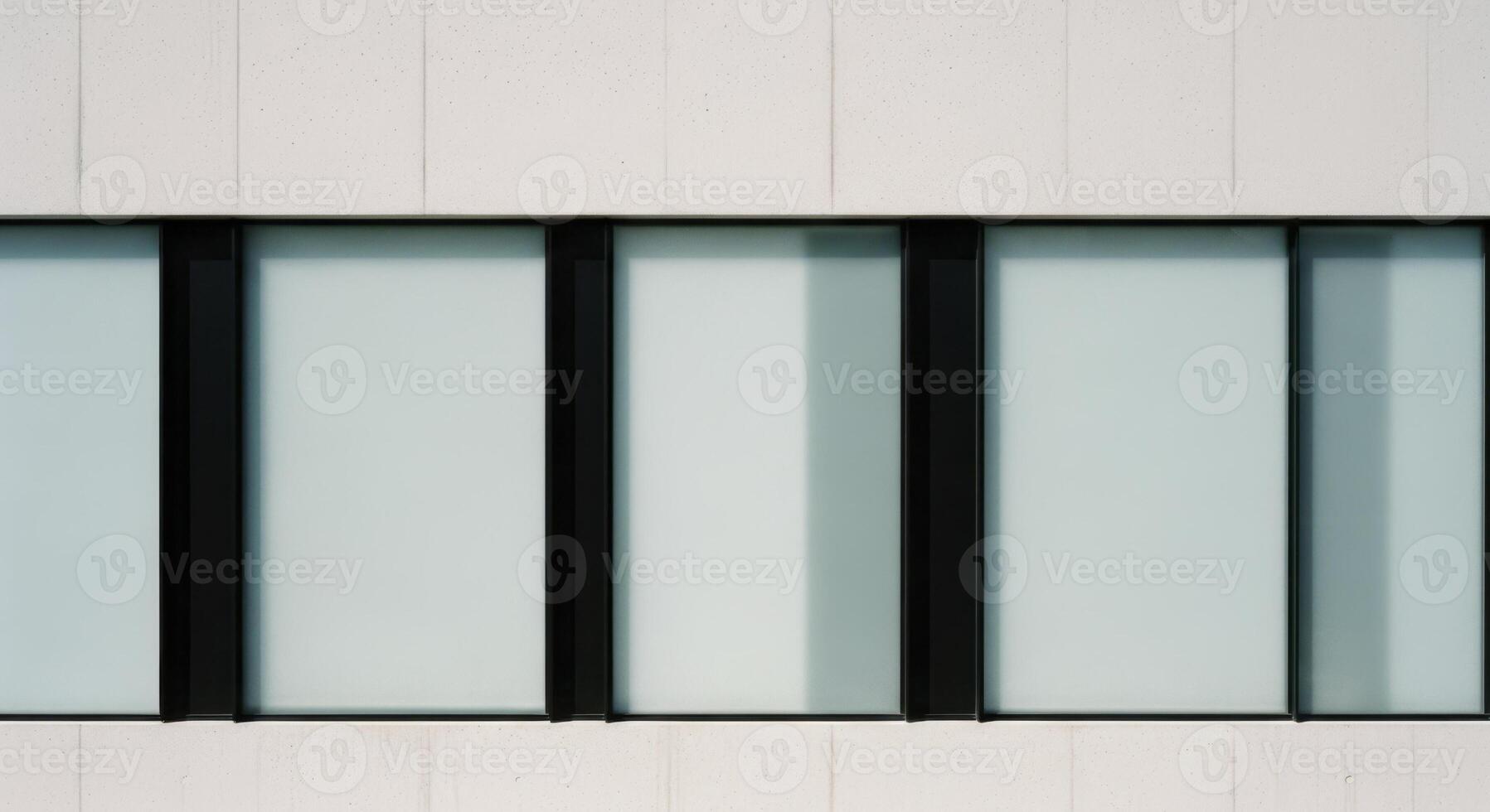 Modern minimalist building facade with frosted glass windows and sleek black frames photo