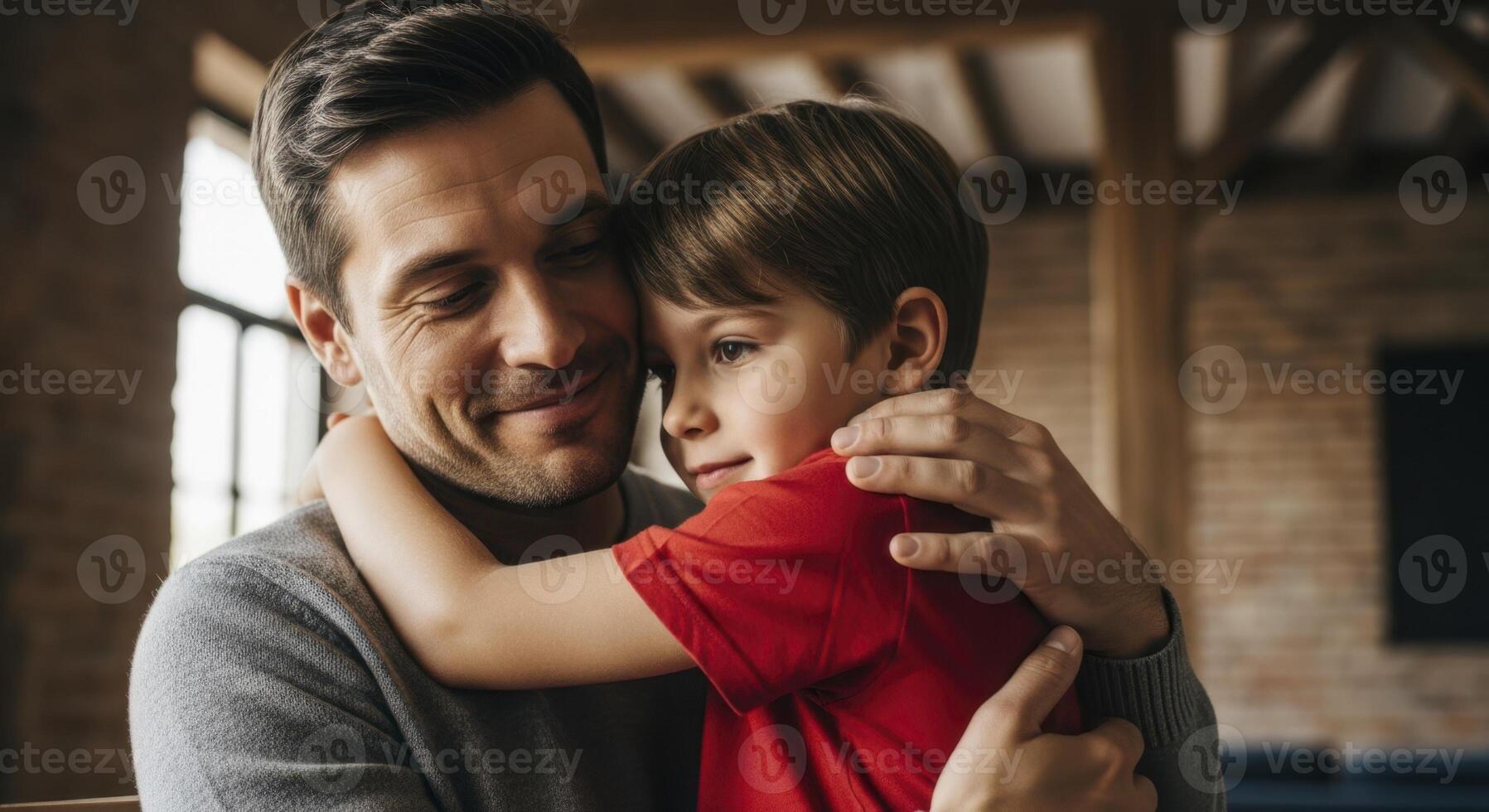 Happy father embracing his young son with love and affection at home photo