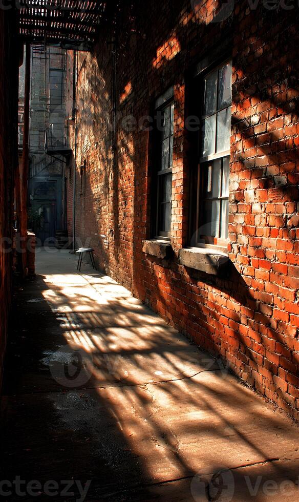 Intriguing interplay of light and shadow dances across the weathered brick in urban alleyway scene photo