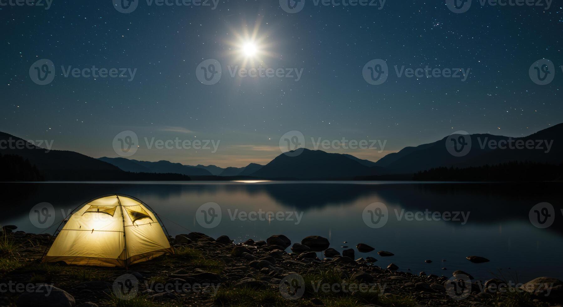 Night camping adventure with illuminated tent under starry sky moonlight reflecting on serene lake with mountain backdrop photo
