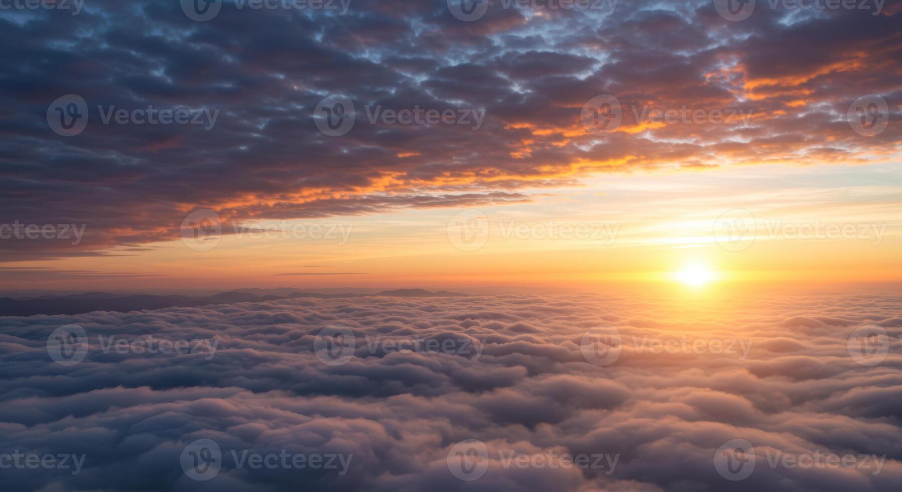 Incredible sunrise above a fluffy cloudscape bathes the vast sky in golden hues creating an uplifting inspiring scene photo