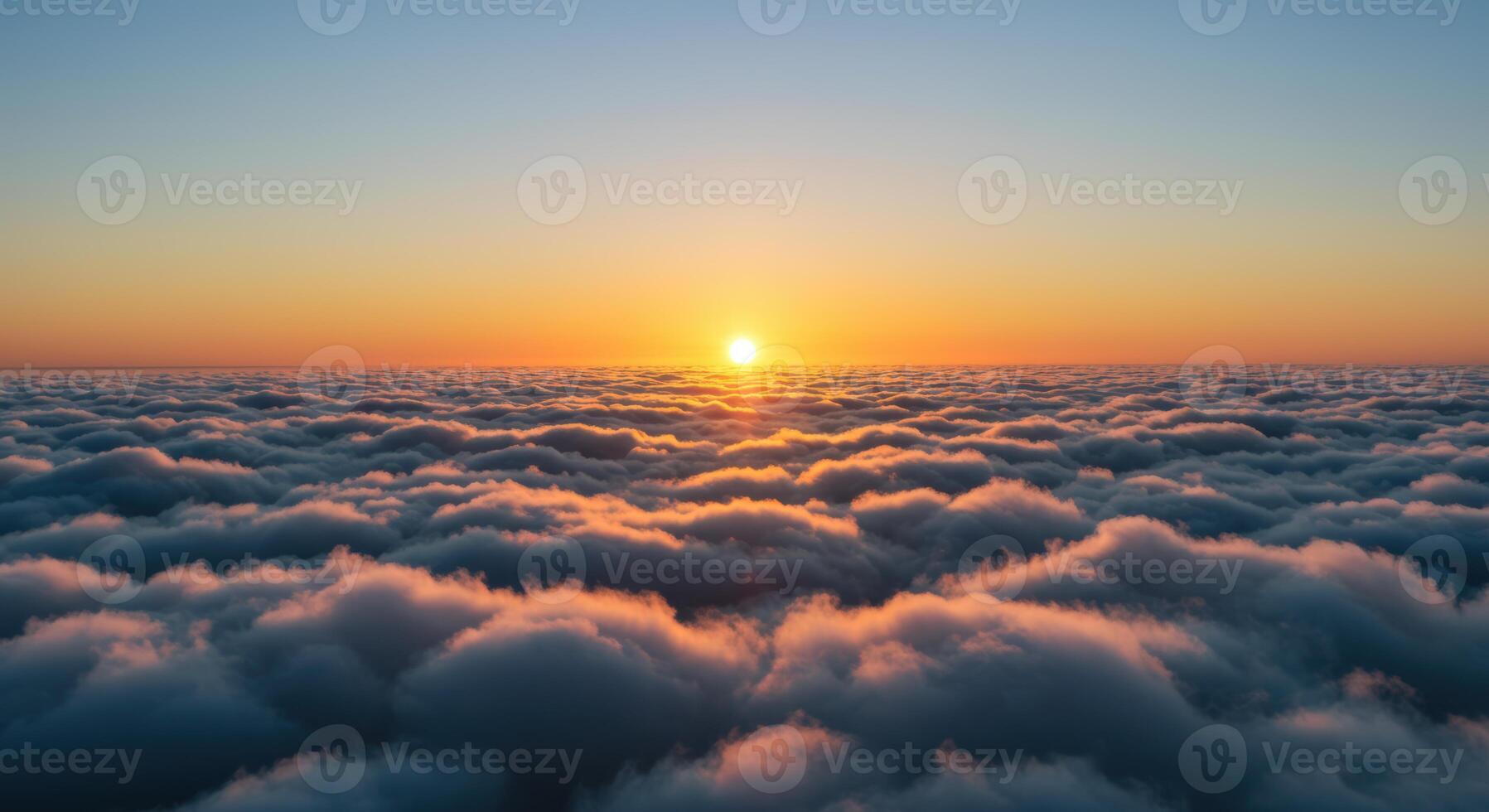 Majestic sunset over a tranquil sea of clouds creating a breathtaking aerial vista of natures serene beauty photo