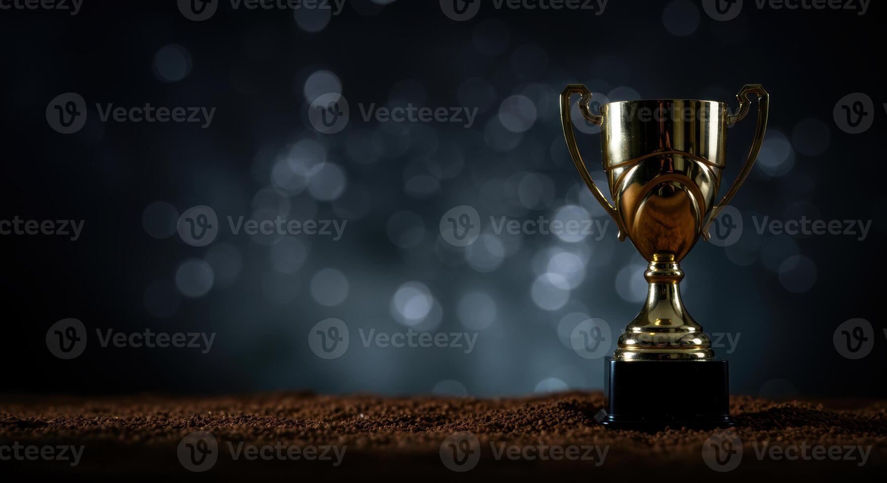 Golden trophy gleams symbolizing ultimate victory and champion status set against a beautiful blurred backdrop photo
