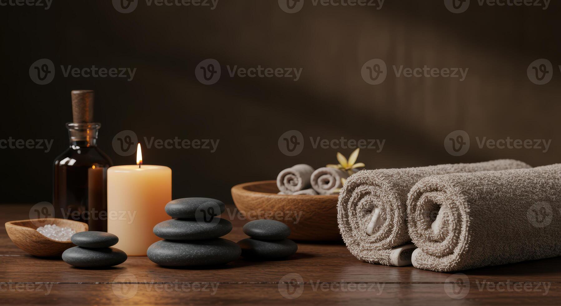 Serene spa scene featuring zen stones aromatherapy candle and soft towels for a peaceful wellness and relaxation retreat photo