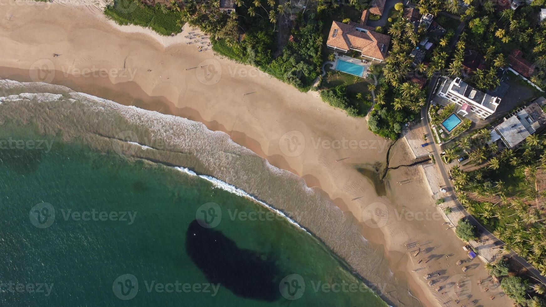 Aerial view of an emerald green sea and big foaming waves. Indian Ocean. photo