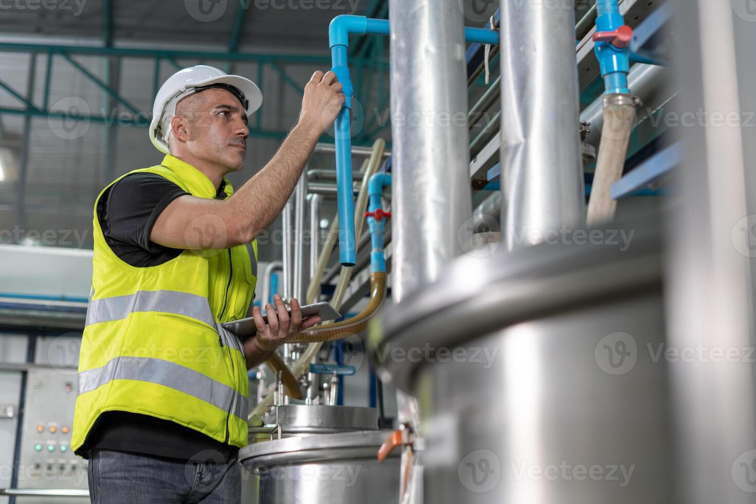 Engineers or factory managers wearing safety helmet inspect the machines in the production line. Utility inspector check machine and test the system to meet the standard. machine, maintenance, photo
