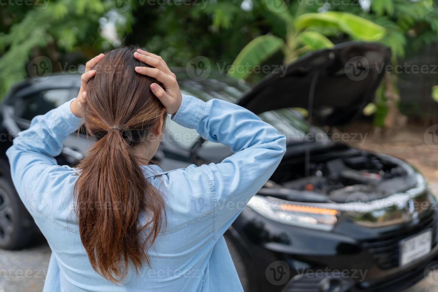 breakdown repair. Stress Woman look engine during car accident . Find garage to get car fixed during country tour, waiting for help, emergency. photo