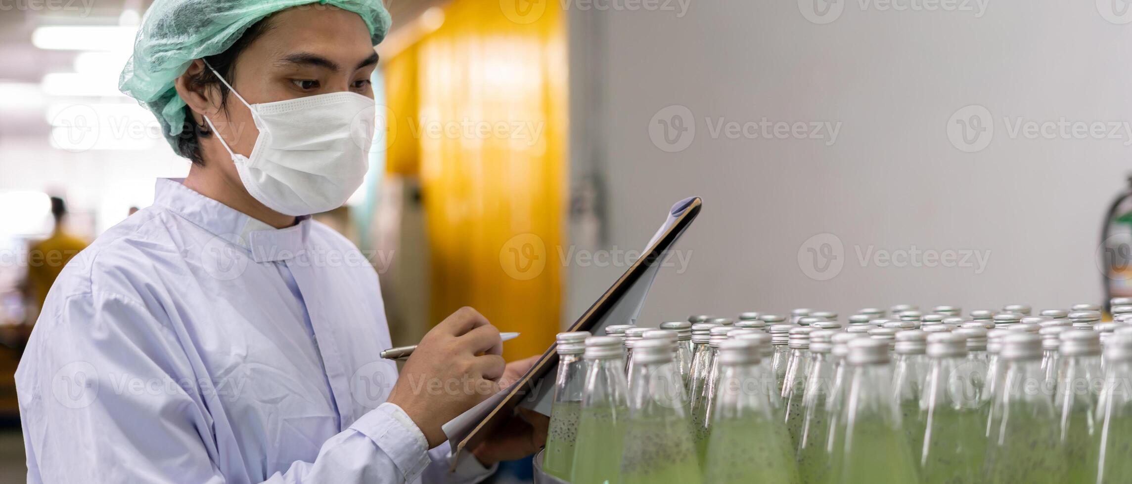 quality inspector food or beverages technician inspection about quality control food or beverages before send product to the customer. Production leader recheck ingredient and productivity photo
