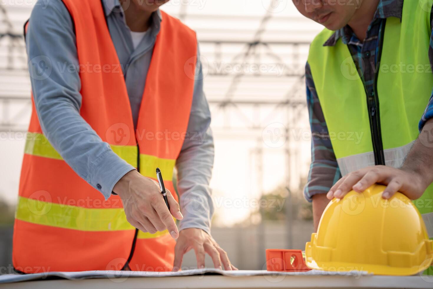 Engineers team and owner discuss check and review the blueprint of construction. Contractor inspection drawing before start project civil. project planning, consulting photo