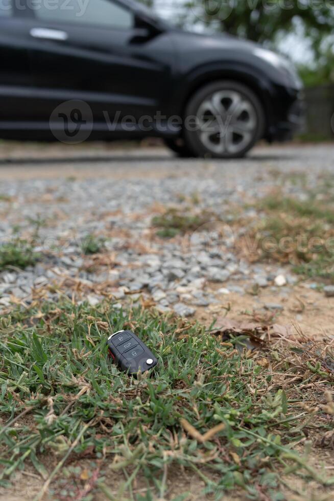 Lost car key in the ground, Car keys dropped on the floor or fall lying on the street home front. Walking Away From Lost Car Key, can not transport, express, rush time, wast time, emergency photo