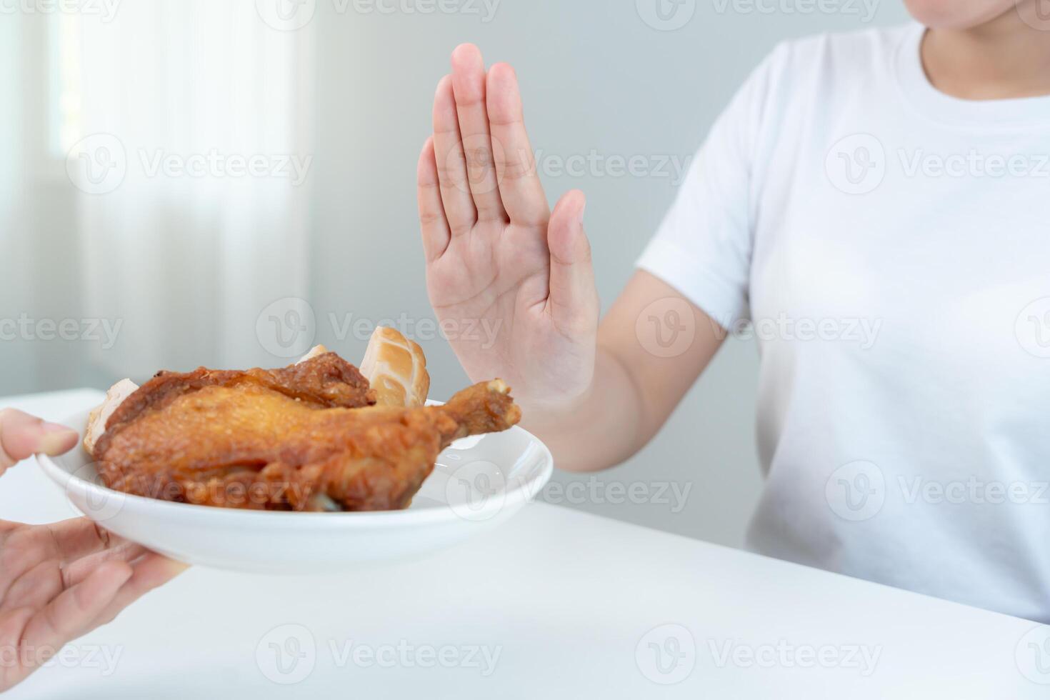 Beauty female body confuse fried chicken. Woman in restaurant achieves weight loss goal for healthy life, crazy about thinness, thin waist, nutritionist. Diet, body shape. photo