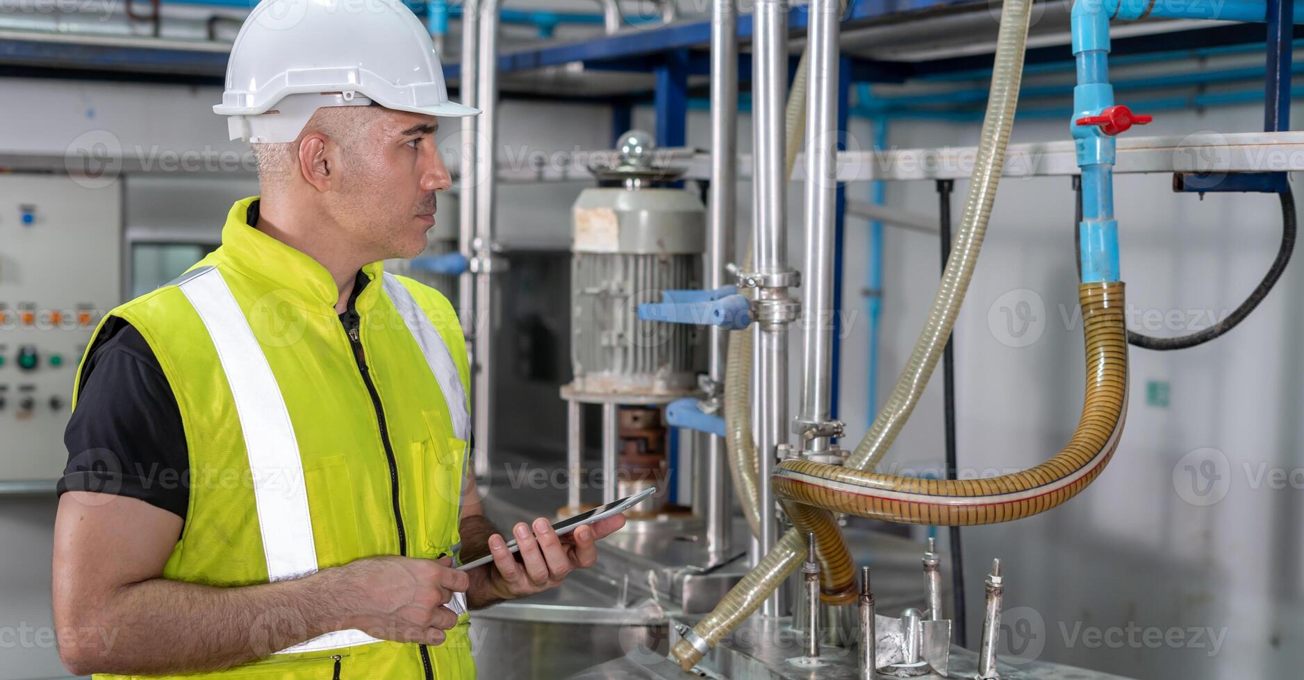 Engineers or utility staff wearing safety helmet fix the machines in the production line. Utility inspector check machine and test the system to meet the standard. machine. Preventive Maintenance. photo