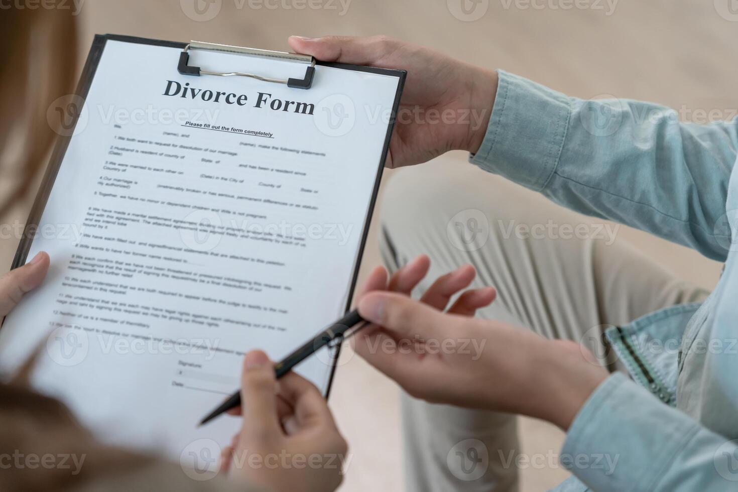 Divorce. husband pass on Divorce form for Wife . Couples desperate and disappointed after marriage. wife sad, upset and frustrated after quarrels conflict. distrust, love problems photo