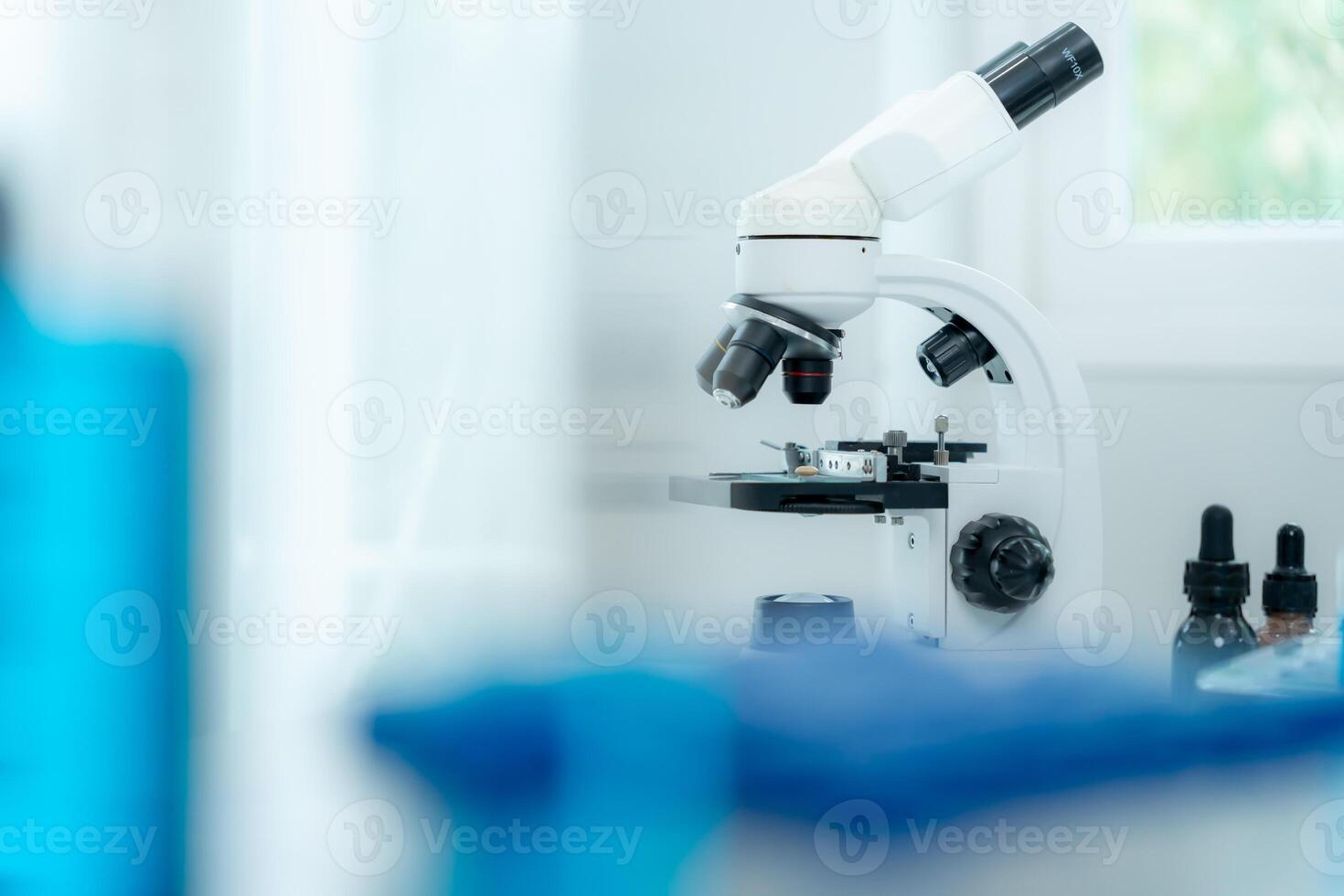 Scientist analyze biochemical samples in advanced scientific laboratory. Medical professional use microscope look microbiological developmental of viral. Biotechnology research in science, photo
