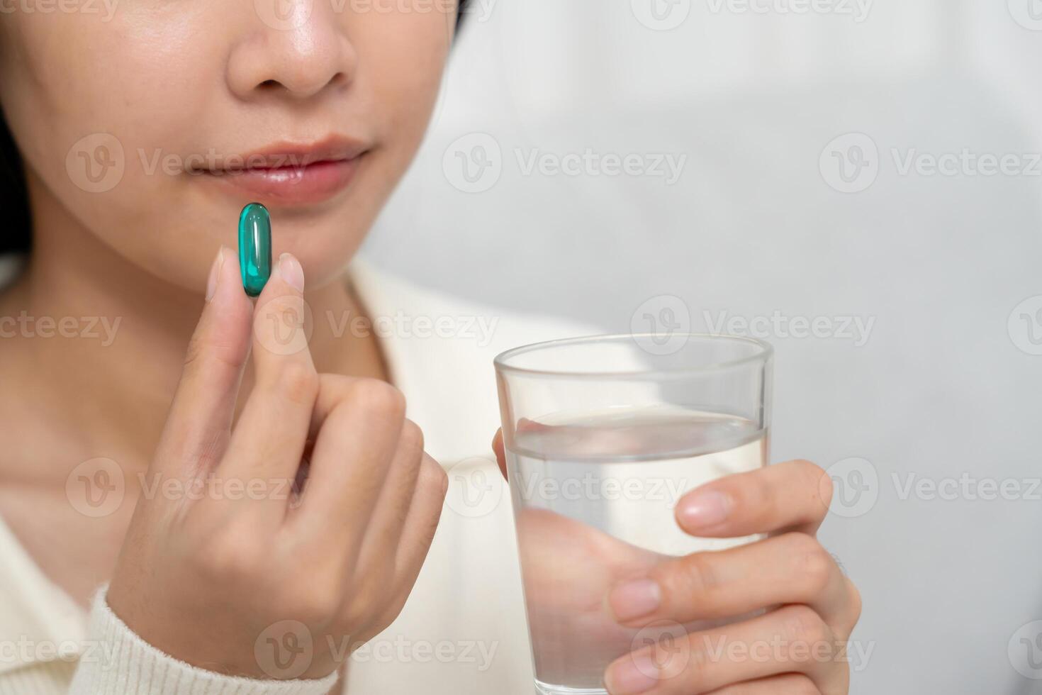 girl holding medicine and take medicine, pain, cure disease, sterilize, take vitamin, sedative, health care, Dietary supplement, medicine for medical treatment, tonic photo