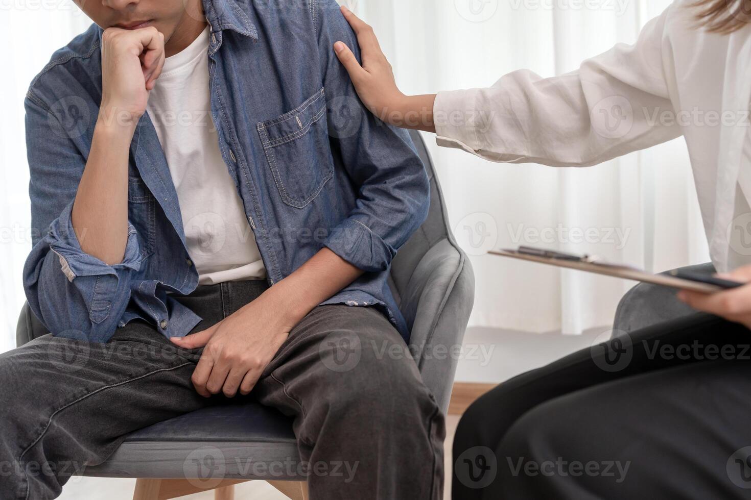 doctor encouraged. Man hold hand in front of private parts feeling discomfort and consult doctor. Venereal, testicular cancer, erectile dysfunction, premature ejaculation, prostate photo