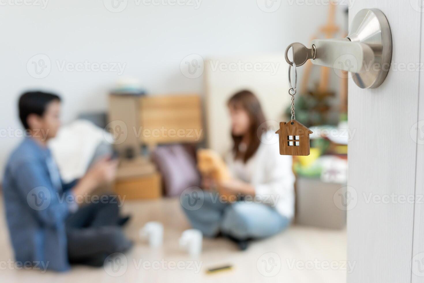 Moving house. Couple help set and move furniture for new apartment, inside the room was a cardboard box contain personal belongings. move in the new apartment or condominium photo