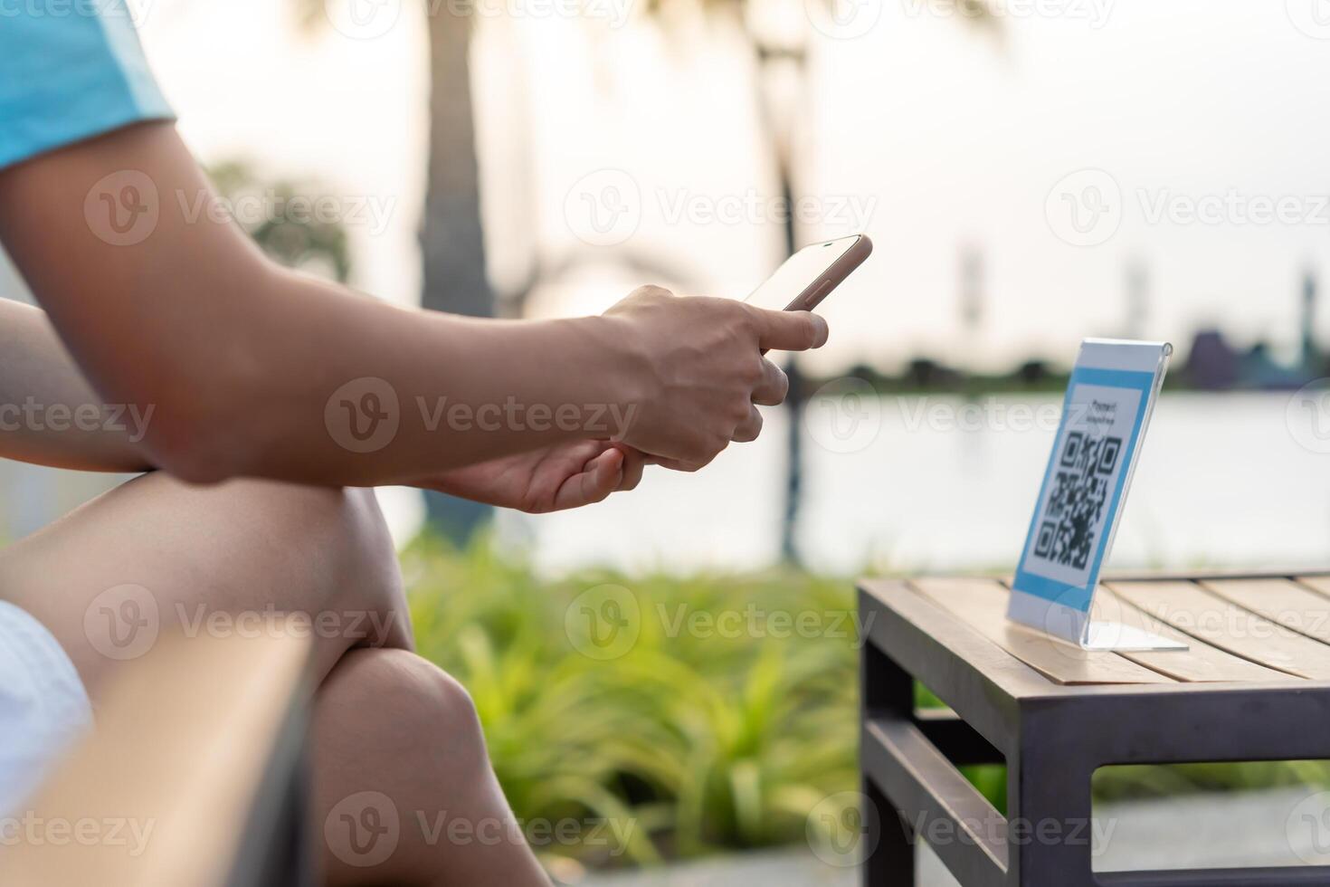 smartphone to scan QR code pay in cafe restaurant with a digital payment without cash. Choose menu and order accumulate discount. E wallet, technology, pay online, credit card, bank app. photo