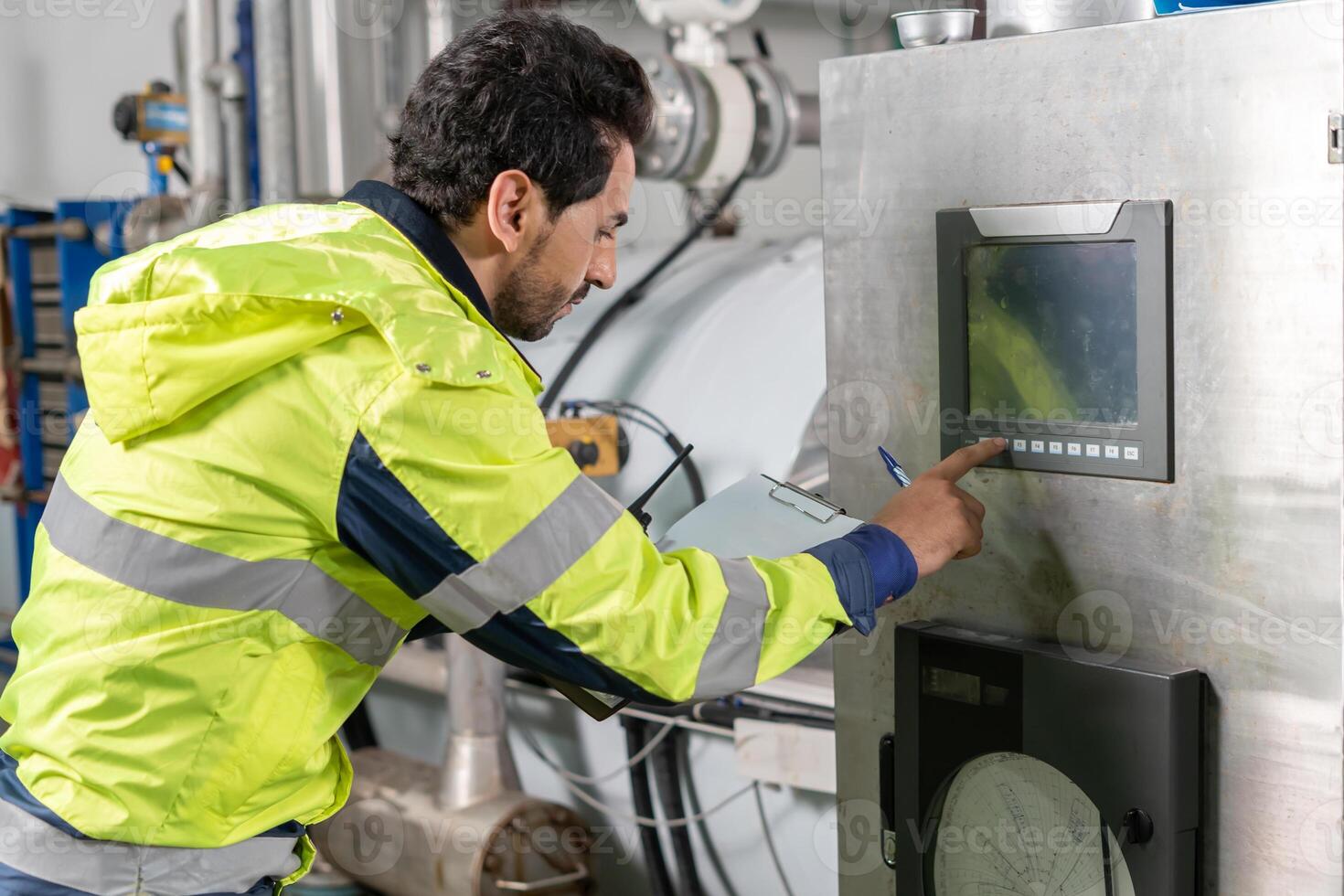 Engineers or factory managers wearing safety helmet inspect the machines in the production line. Utility inspector check machine and test the system to meet the standard. machine, maintenance photo