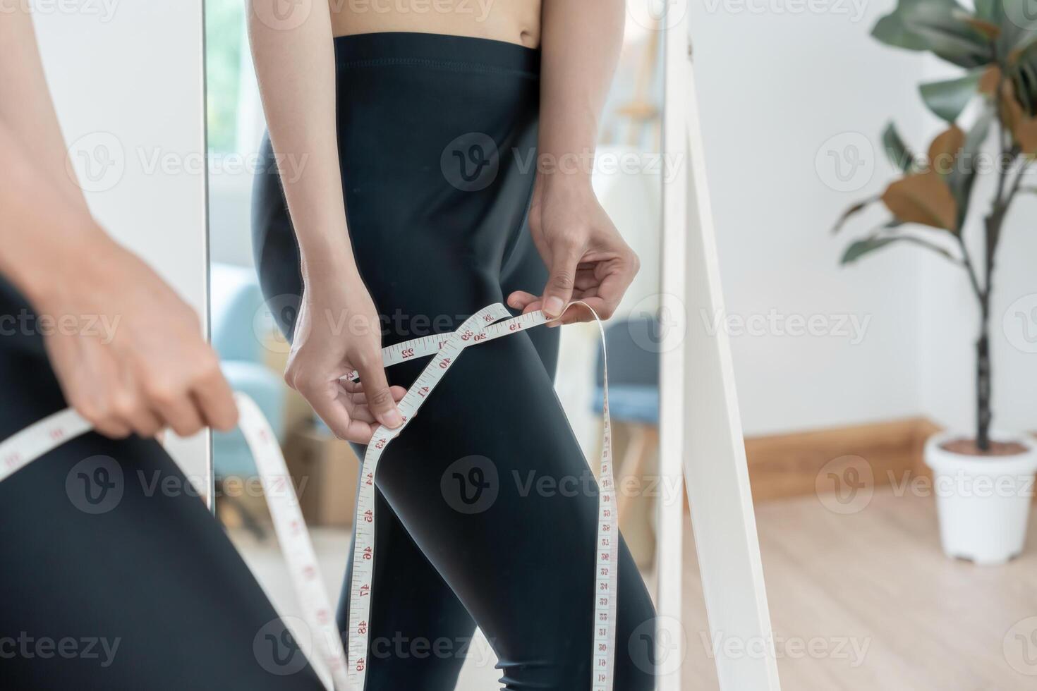 Women showing results of diet. Beautiful shape. female show shape body have a reduced waist size after under going a weight loss corse. balance, control, routines photo