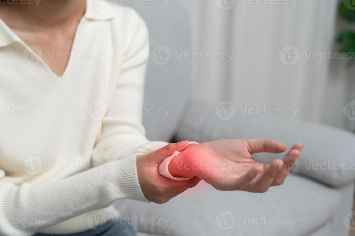 woman workin office with a carpal tunnel syndrome or wrist joint inflammation, hand muscle inflammation from office syndrome , hand muscle pain from work. photo