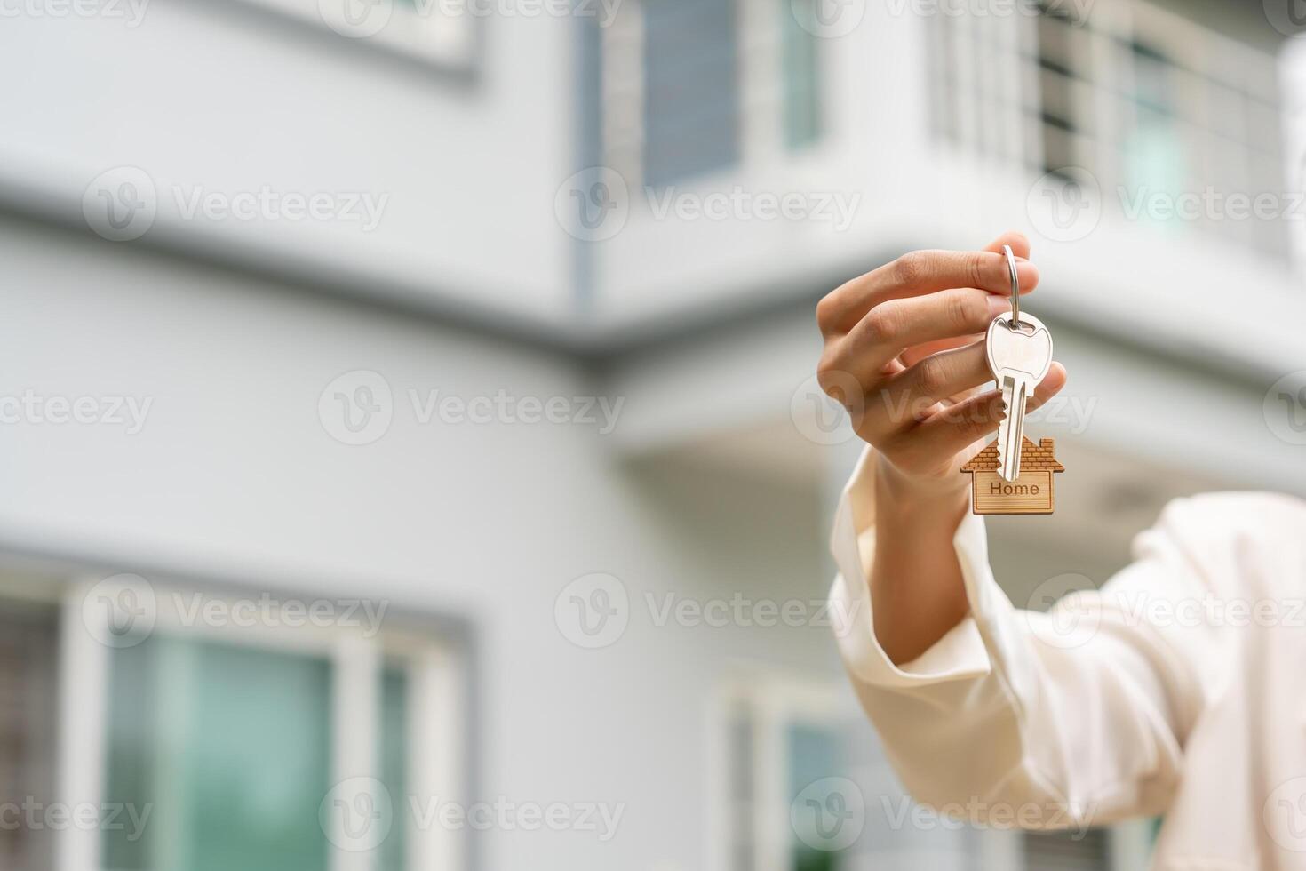 lease, rental and sell home. Real estate agent manager smile holding key for new owner. rent house, Sales, loan credit financial, insurance, Seller, dealer, installment, buy, sell, move in. photo