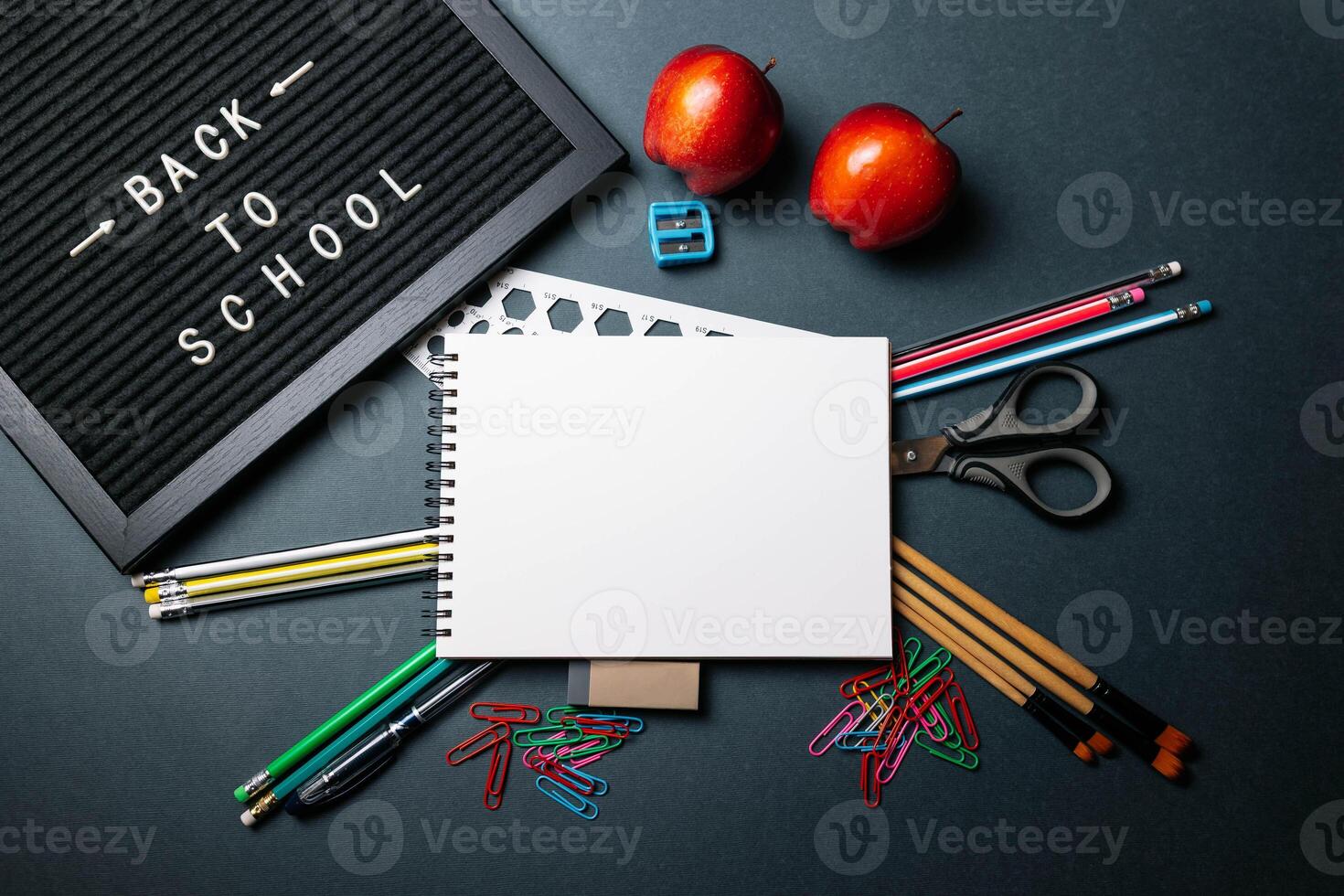 Back to School Letter Board Surrounded by Pencils and Apples photo