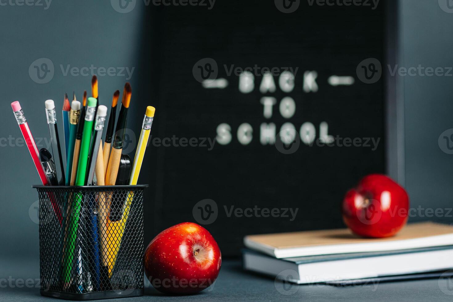 Back to School Message on Felt Board with Pencils and Apples photo