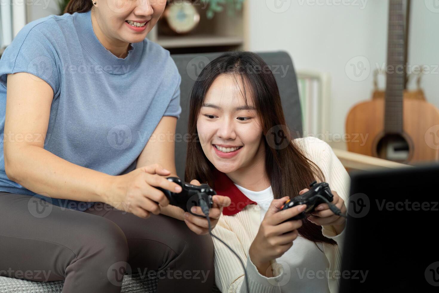 Mother and Daughter Enjoying Games Together photo